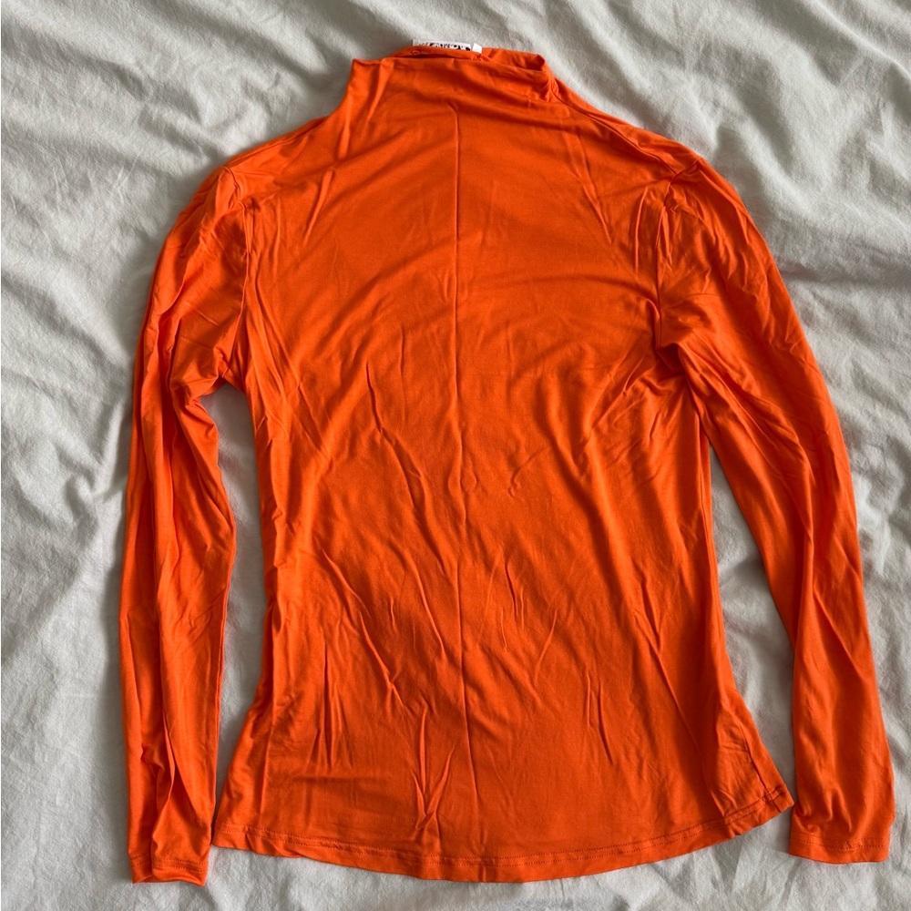 Orange turtleneck spandex material size medium